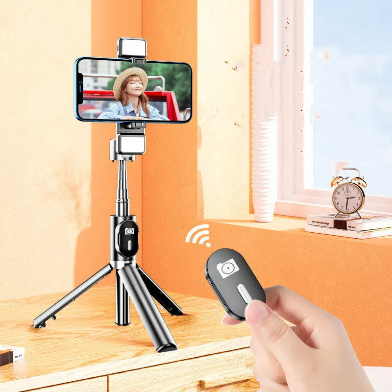 Selfie stick with aluminium alloy body and phone holder in tripod mode on a desk
