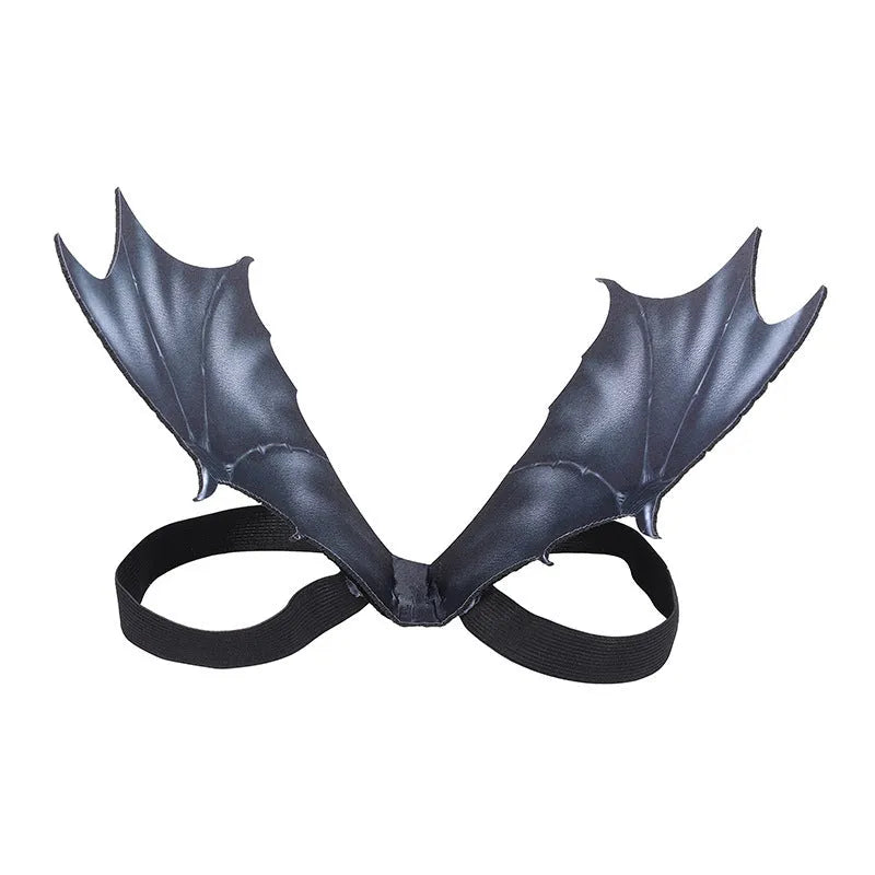 Black cloth bat wing costume for dogs and cats on a pet, showing three available sizes.