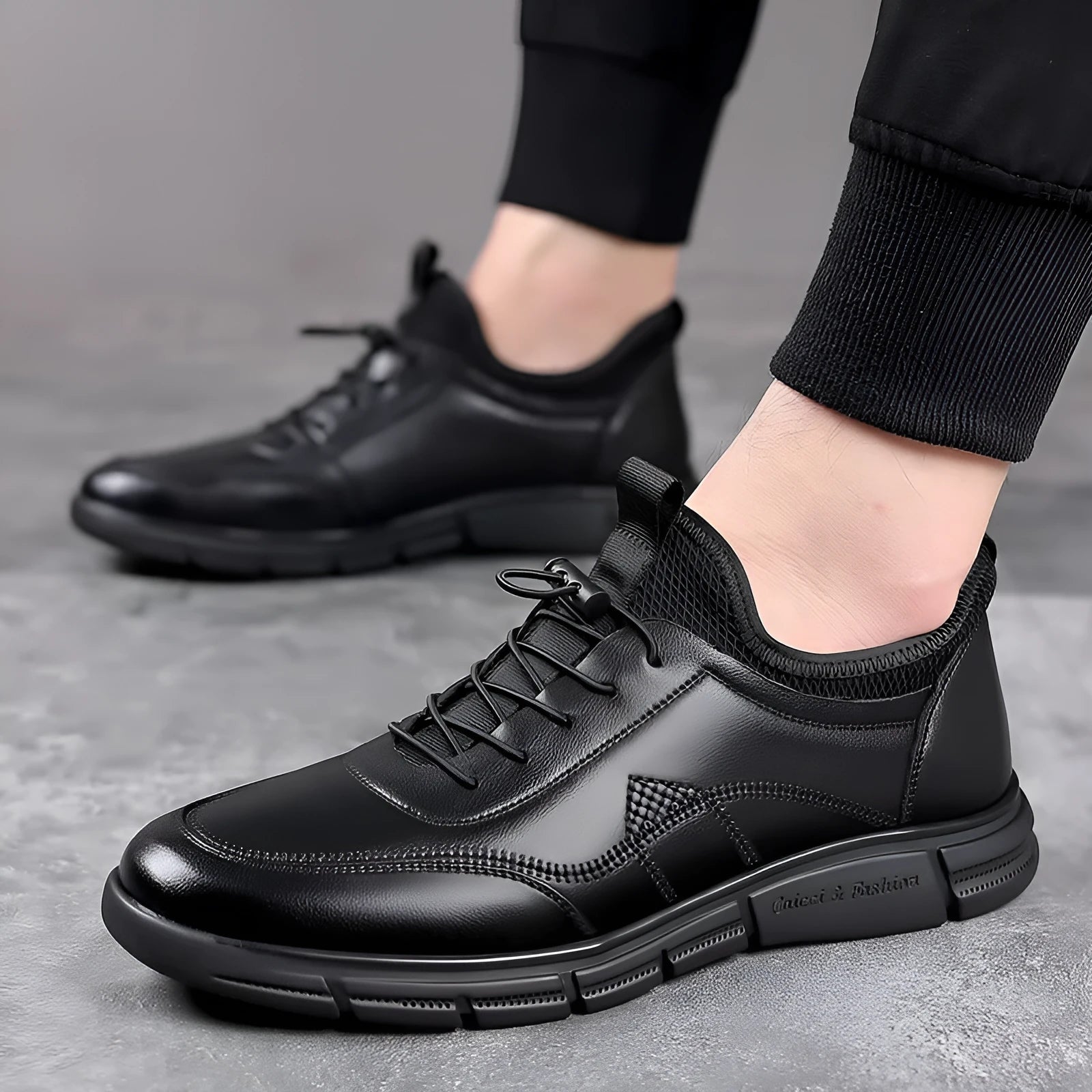 Men's black low heel casual shoes with round toe and square heel on a plain background