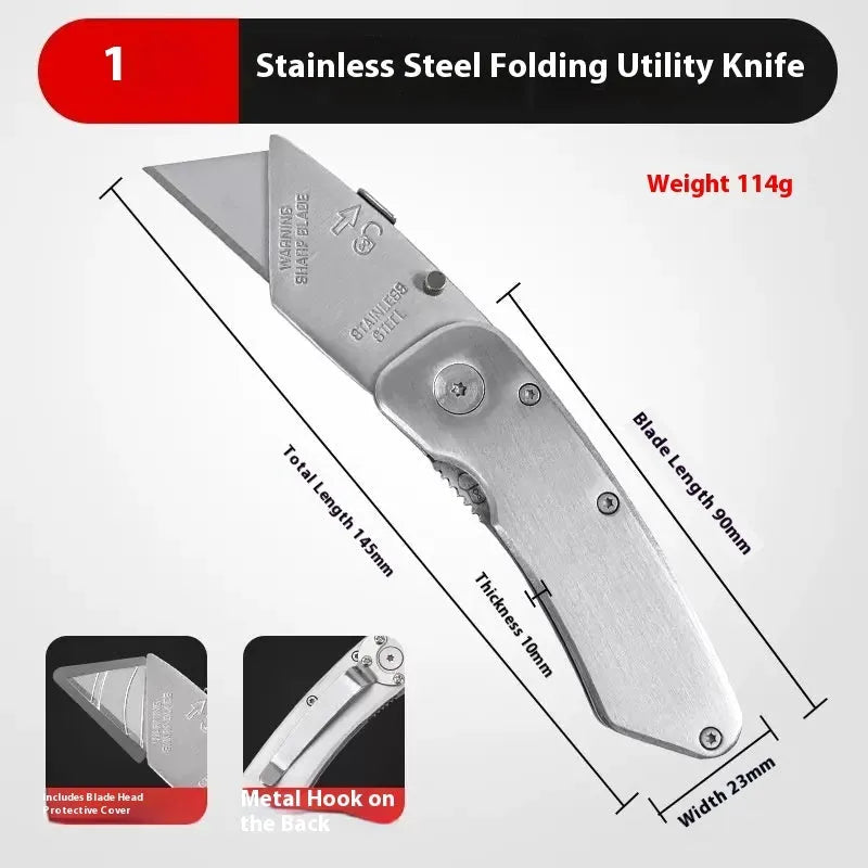 Stainless steel folding art knife with black blade and 20 spare blades on a work surface