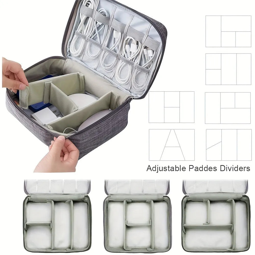 Black electronics organiser case open to show mesh pockets, elastic loops and removable padded dividers inside.