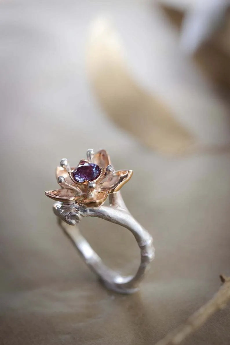 Silver tone women's ring with geometric floral design and two-tone finish