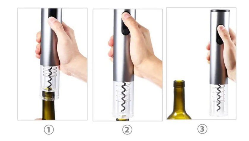 Silver automatic electric wine opener with foil cutter on a kitchen counter next to a red wine bottle
