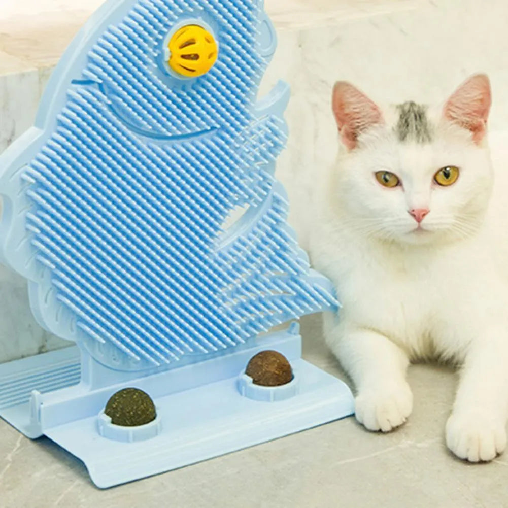 Blue fish-shaped cat wall scratcher with self-grooming brush and two green catnip balls on a base