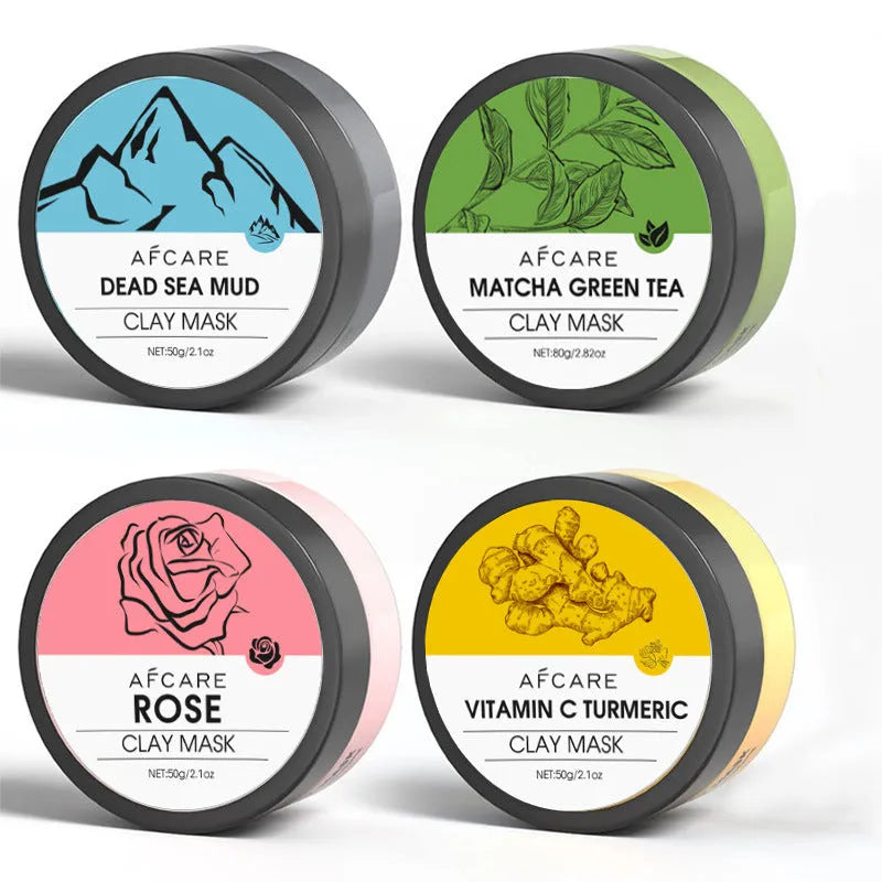4 pack of Dead Sea mud, green tea, turmeric and rose clay face masks in 80ml pots on white background
