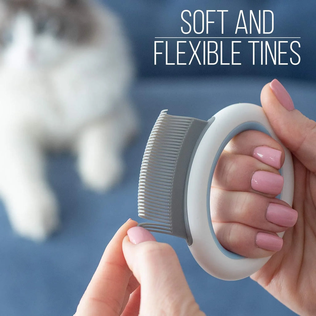 Blue pet deshedding comb with soft plastic teeth and an ergonomic handle on a white background.