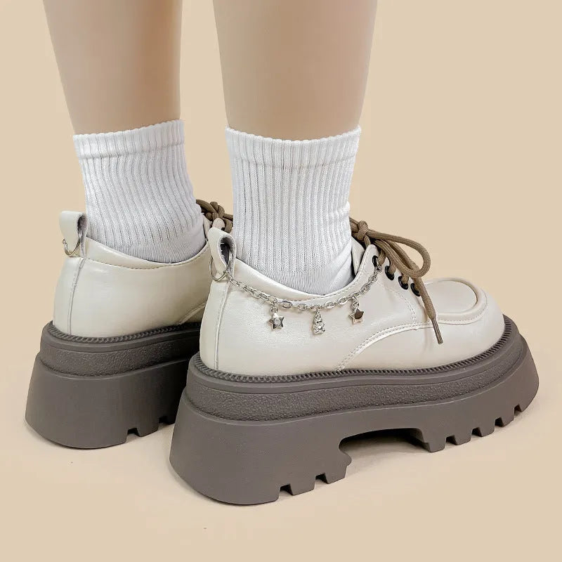 White women's Mary Jane platform shoes with thick chunky heel and front lace-up detail.
