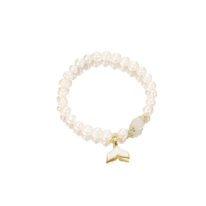 Natural freshwater pearl fishtail bracelet for women, handmade original design on display
