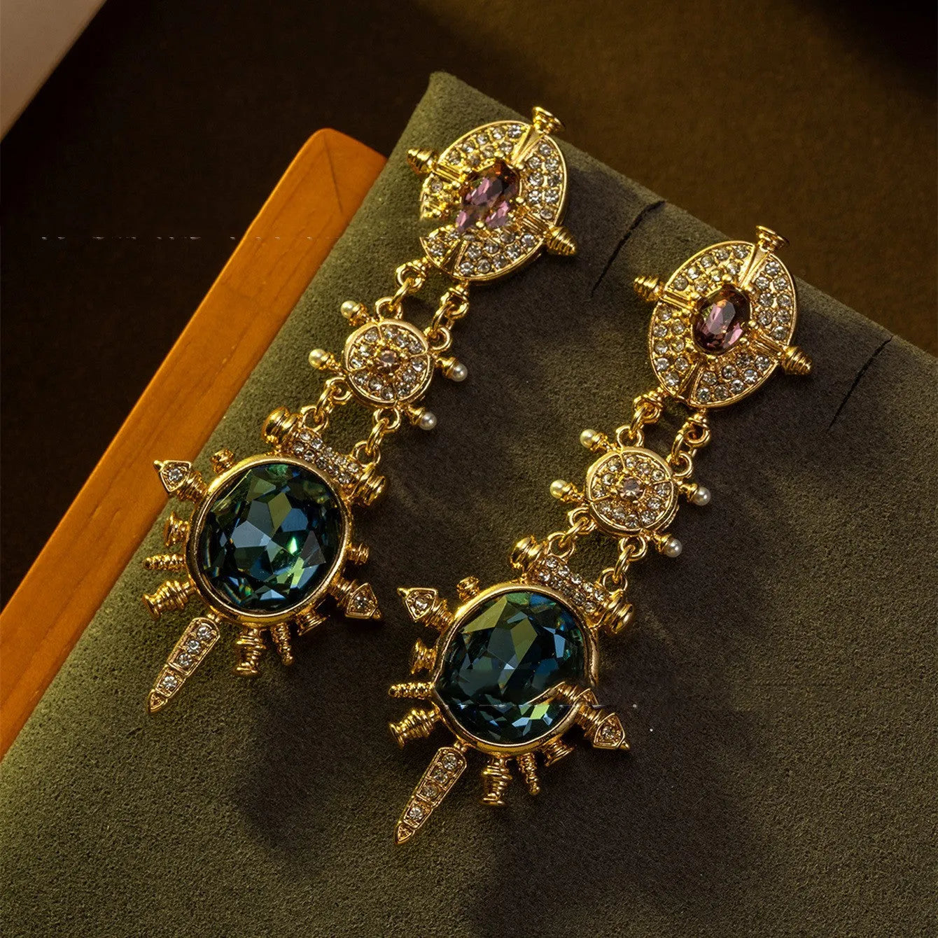 Gold retro geometric stud earrings with round design elements and diamond treatment