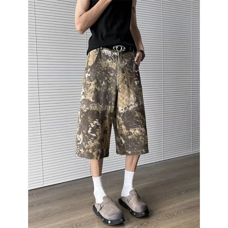 Yellow jeans with snake pattern camouflage design in cropped length