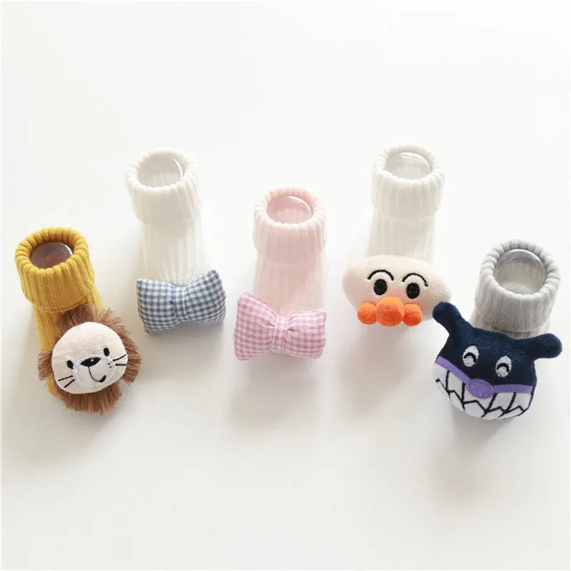 Cotton baby floor socks in multiple patterns including blue bow and lion designs