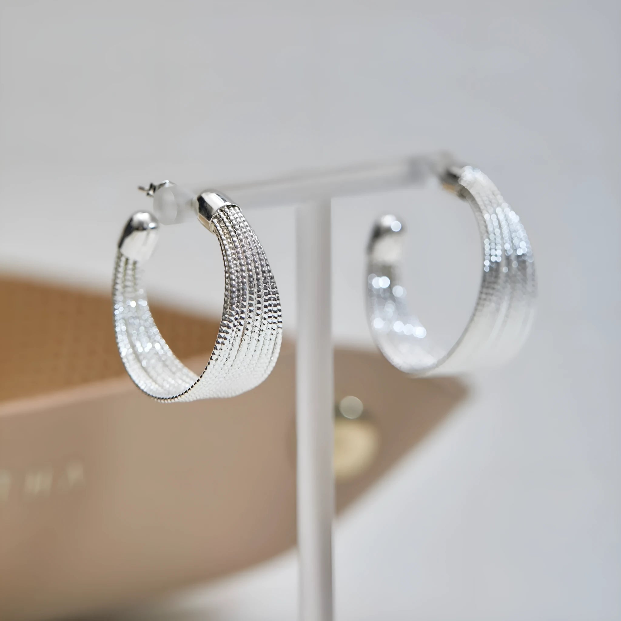 Copper geometric bracelet earrings set showing silver and gold electroplated stud and clip earring pairs