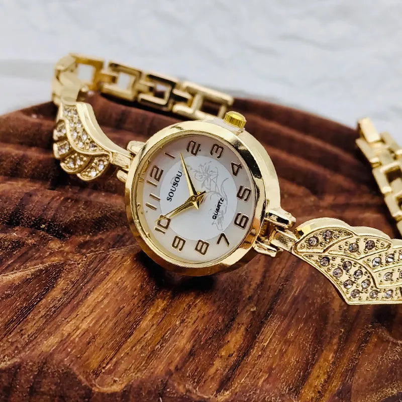 Women's stainless steel watch with round dial showing gold face colour option and Vachette clasp buckle