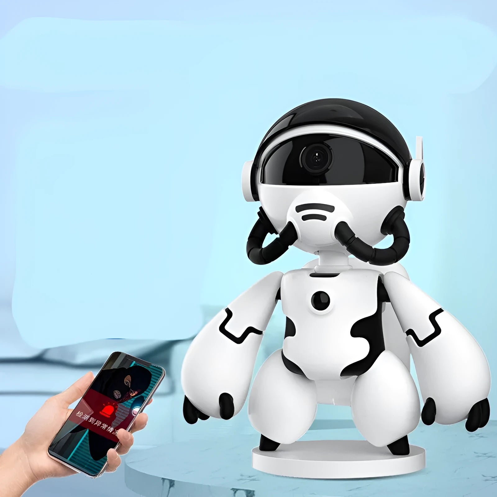 White battery-powered indoor security camera on a table with detachable base.