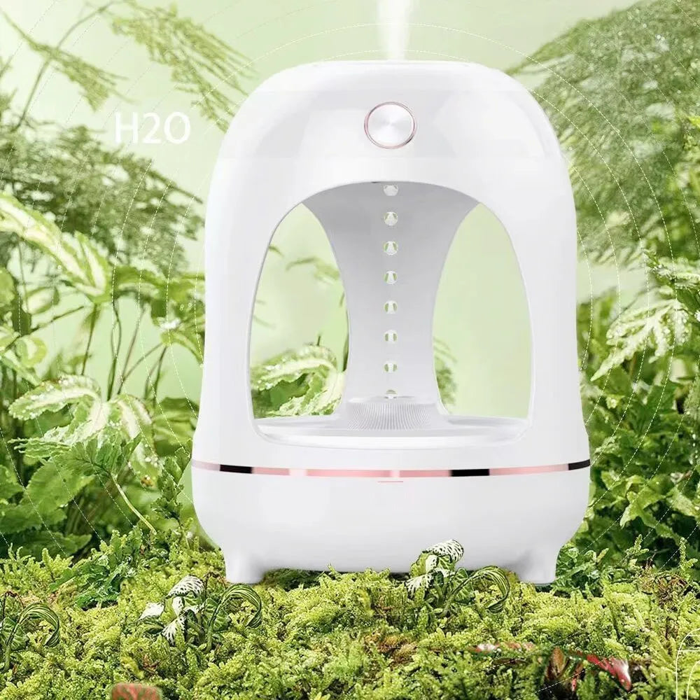 Anti gravity levitating water drops ultrasonic humidifier with LED night light in rose gold and white on a desk