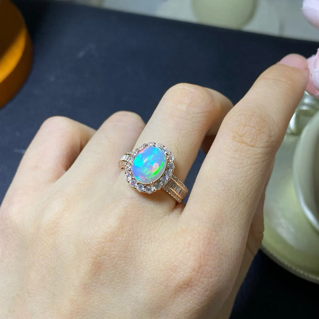 Handmade natural opal silver ring in gold colour with adjustable opening on hand