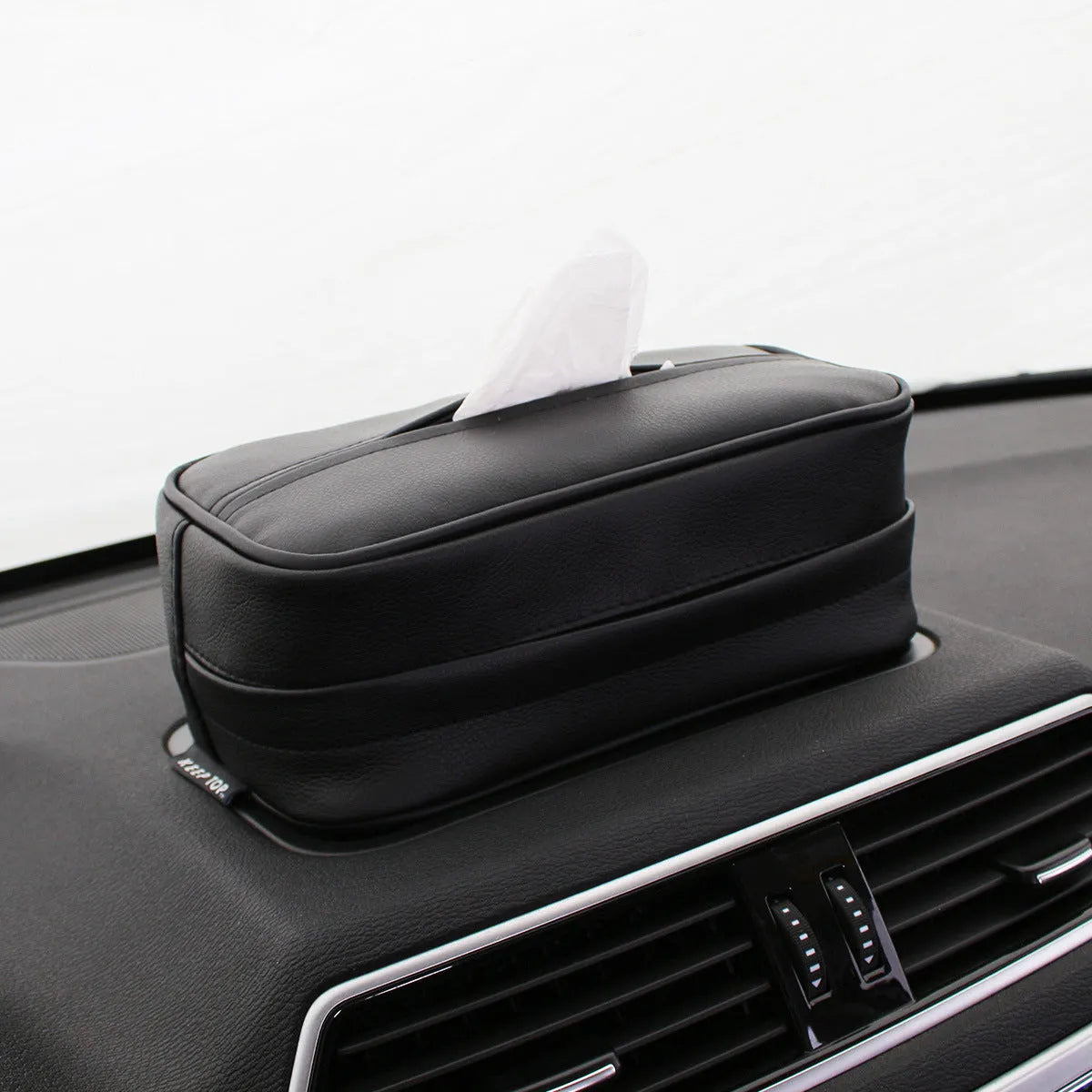 Black leather hanging storage box with paper bag for car or home organisation
