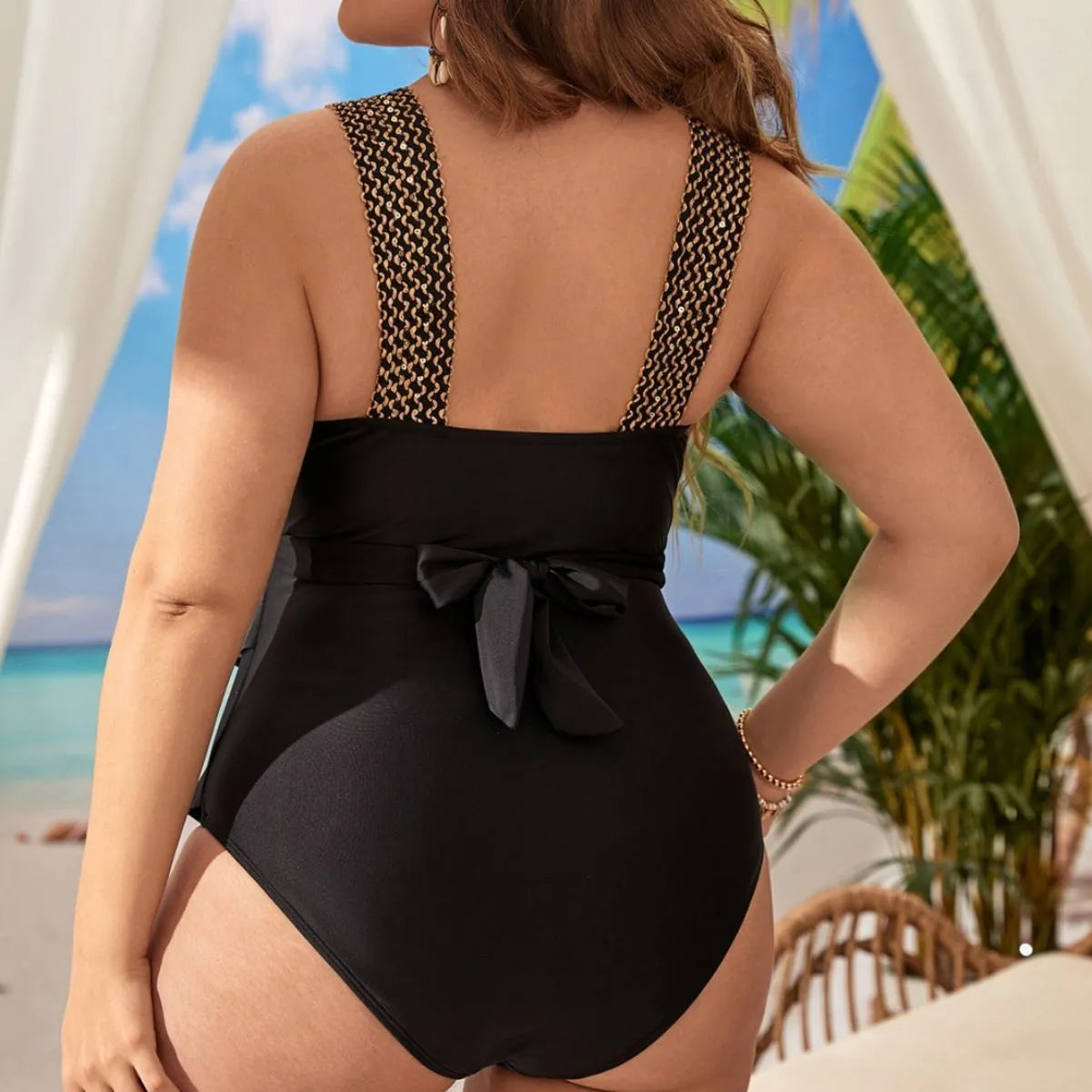 Women's black sleeveless one-piece swimsuit with a built-in chest pad on a mannequin.