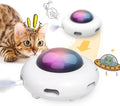White interactive UFO cat toy with colourful LEDs and feather holes on a wooden floor