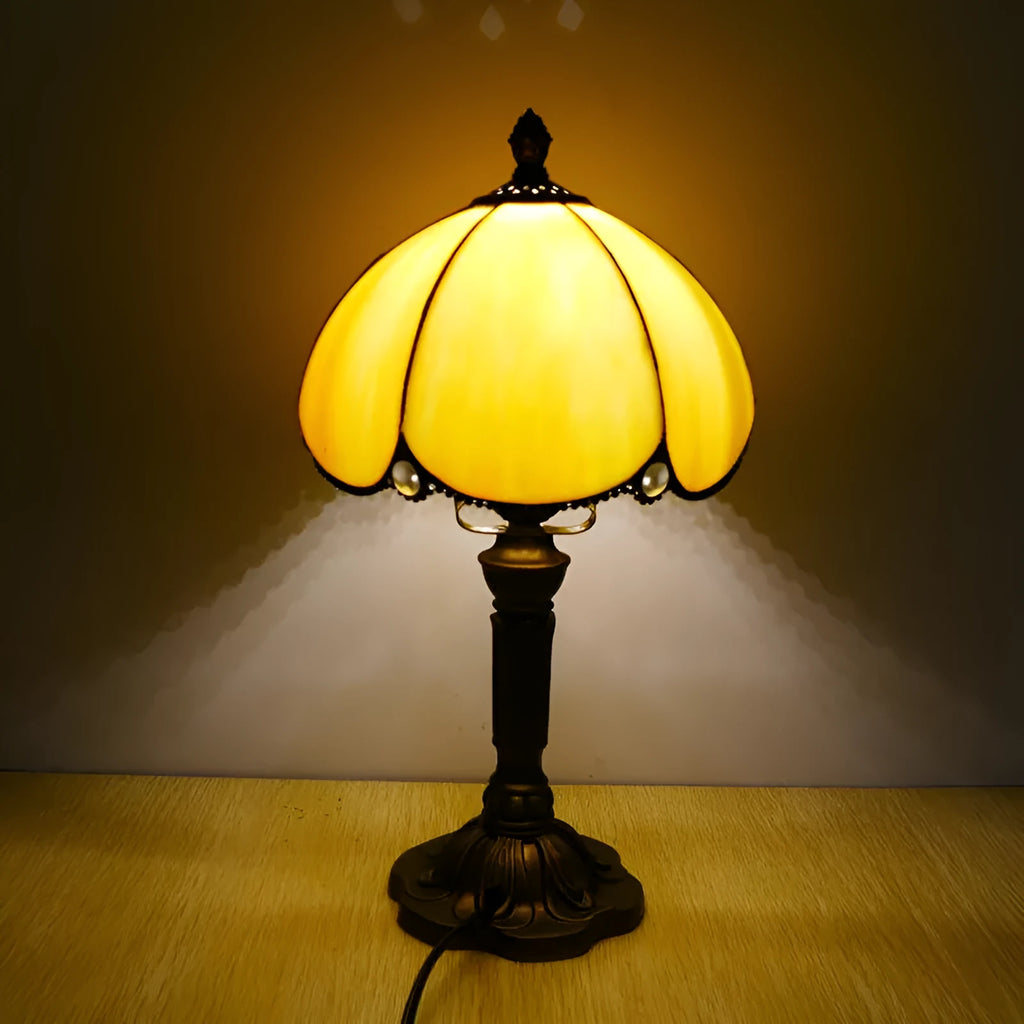 Beige simple modern creative art bedside lamp 20cm width on a bedside table