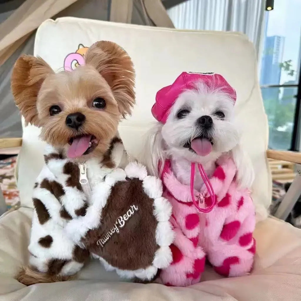 Small dog wearing a plush pink warm coat for cold weather protection