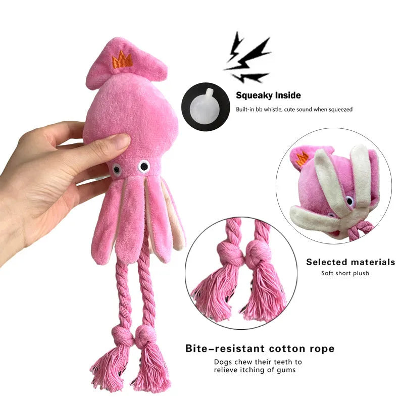 Pink squid-shaped plush dog chew toy with squeaky whistle, corduroy fabric, 32cm body length