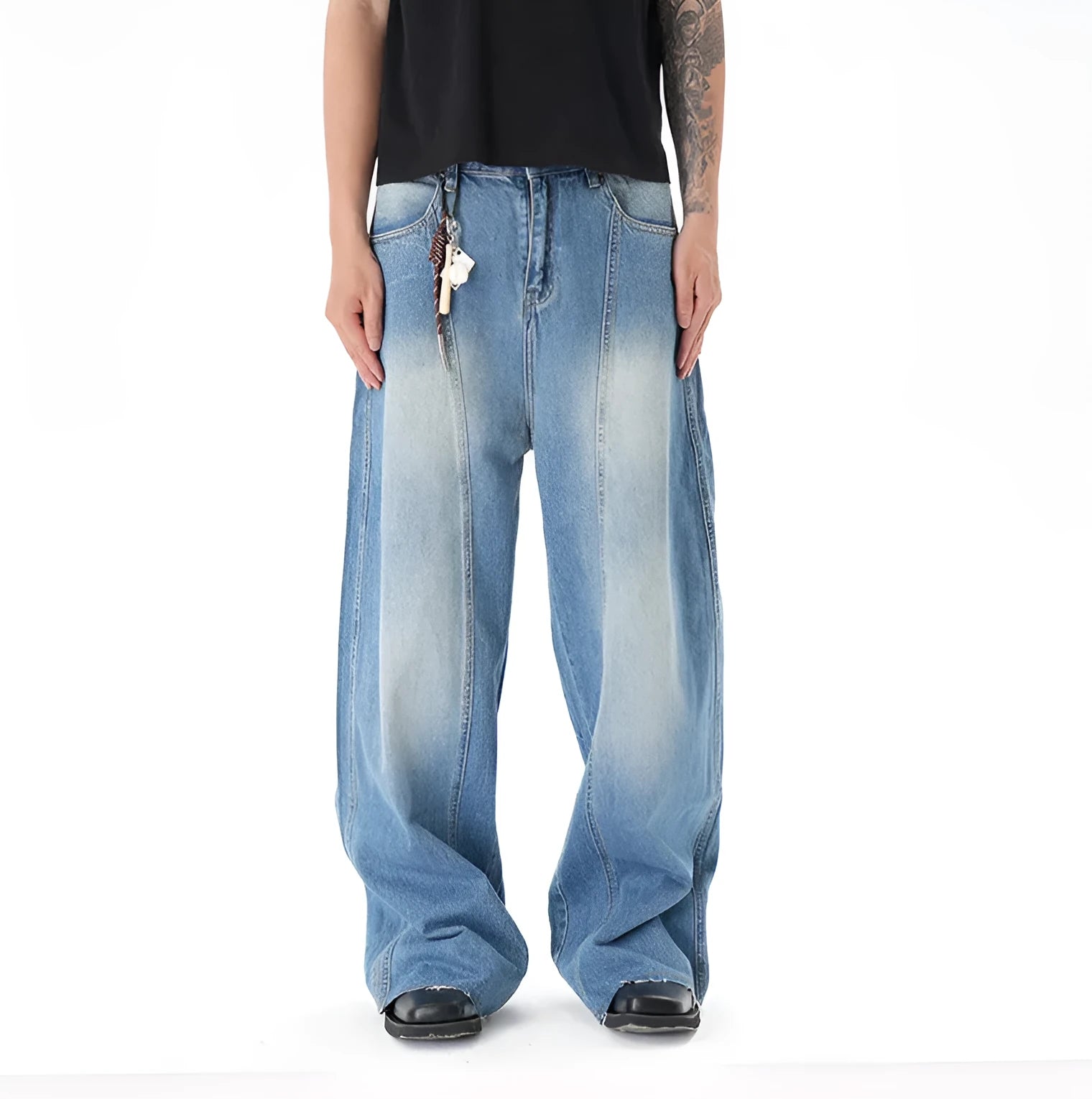 Light blue wide leg machete jeans with vintage washed denim finish, zip-fly closure, cut wash effect