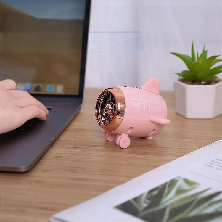 Mini wireless Bluetooth speaker in pink, 85mm x 75mm x 70mm, with plastic body and USB port