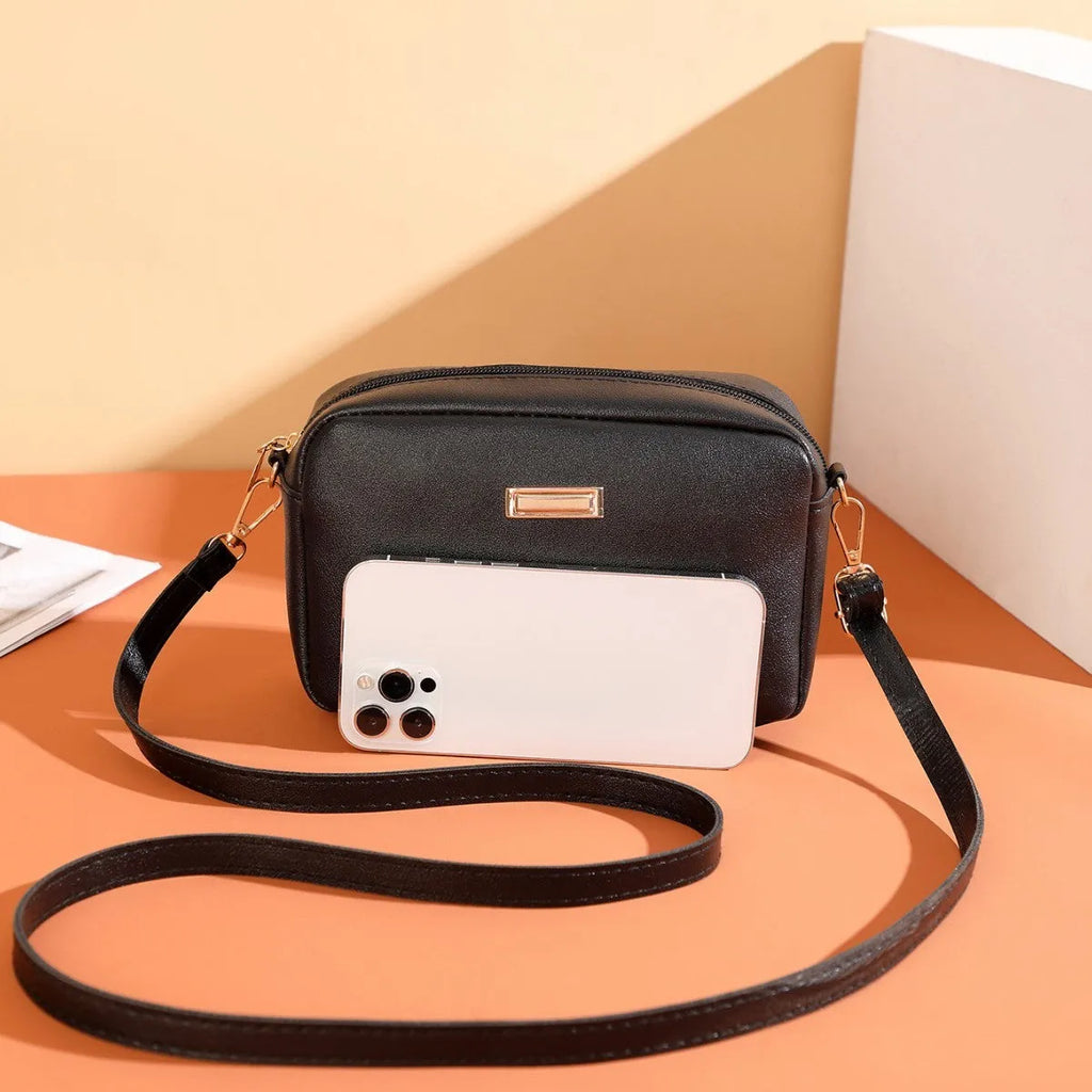 Women's square shoulder bag in PU material with a 3D front pocket, shown in a solid colour.