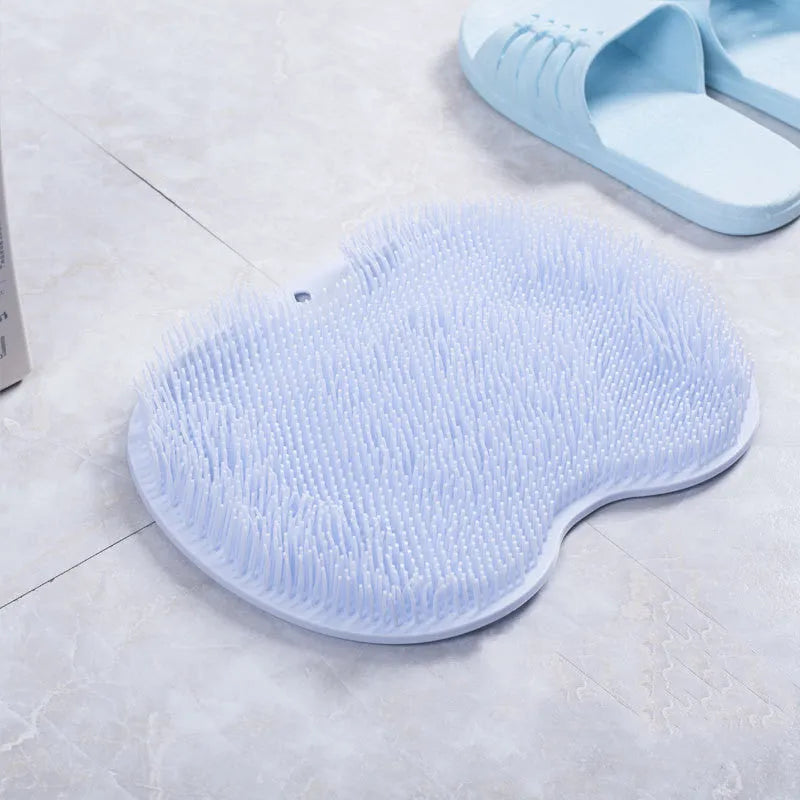 Non-slip bath mat with silicone bristles and suction cup base in a shower
