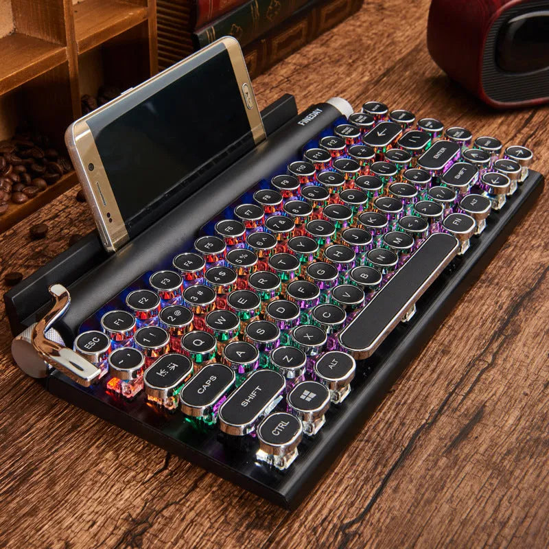 Black Dot retro-style mechanical keyboard with backlit keys on a desk.