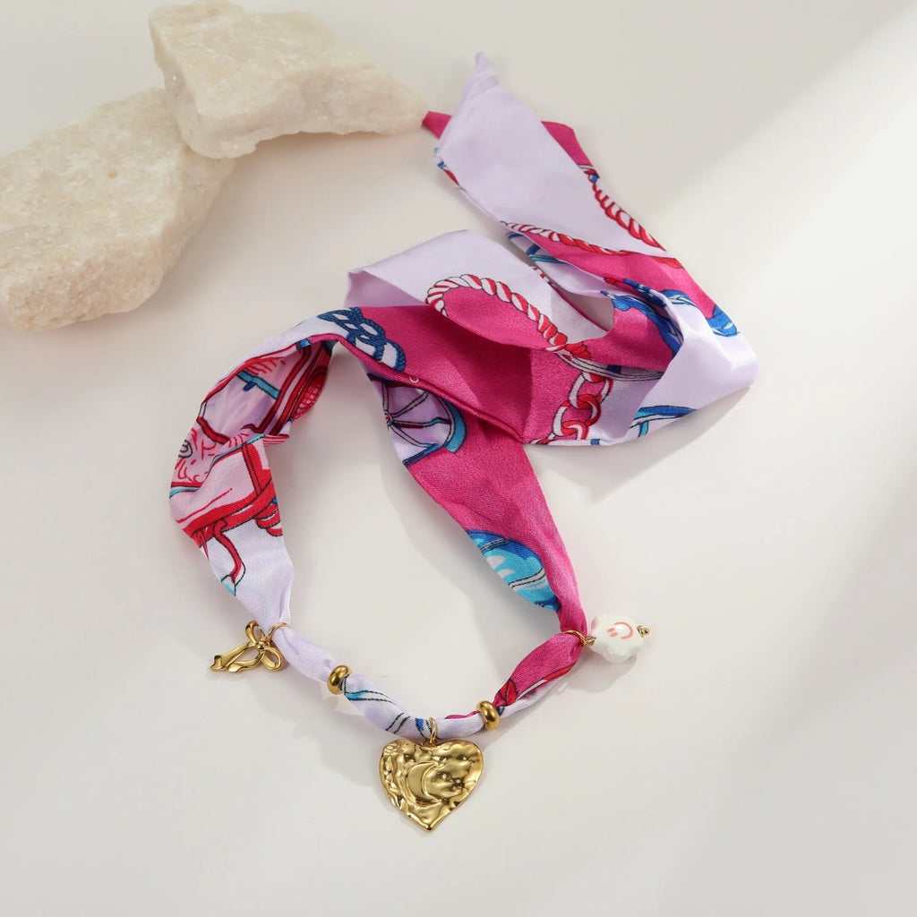 Stainless steel necklace and bracelet set with colourful silk scarf pendants on geometric designs