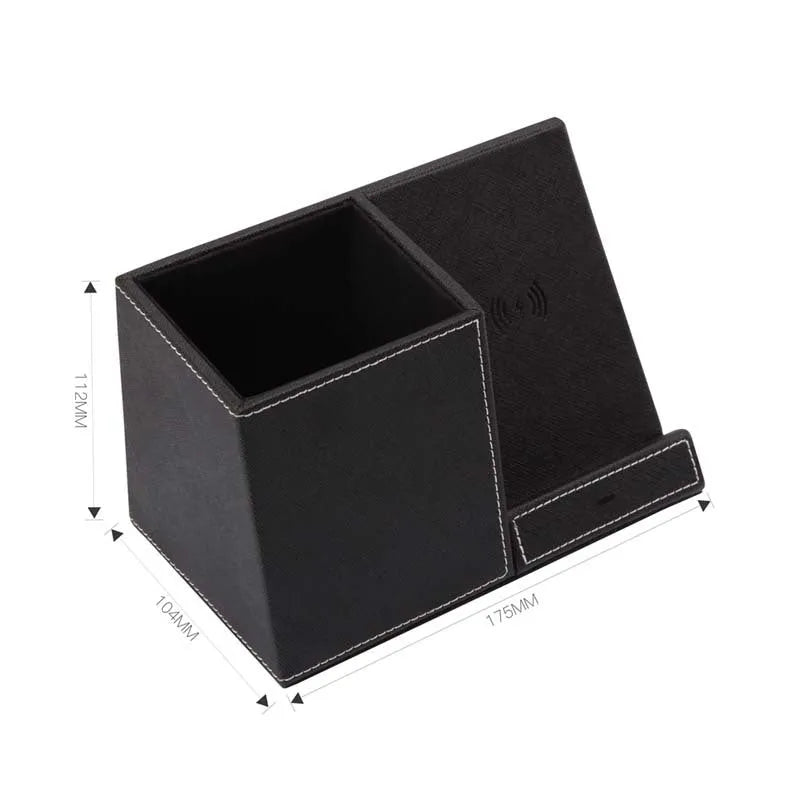 Leather pen holder wireless charger on desk with phone charging and pens organised