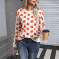 Women's beige loose fit polyester sweater with maple leaf contrast colour pattern and round neck