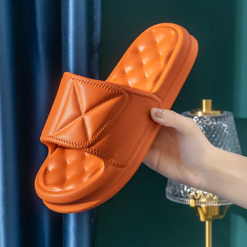 Pair of thick EVA bathroom slippers with textured anti-slip sole in a choice of five colours.