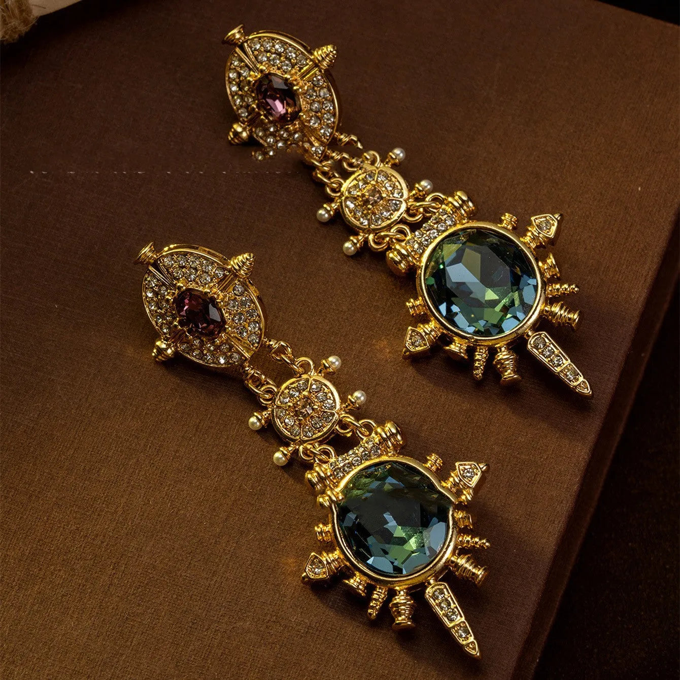 Gold retro geometric stud earrings with round design elements and diamond treatment