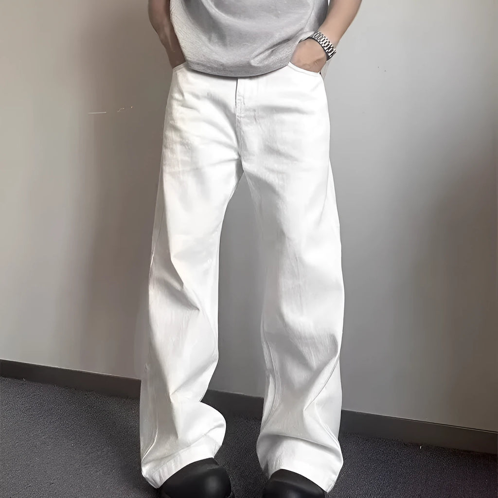 Men's loose fit straight leg white denim jeans on a hanger, showing wide leg opening and zipper fly.