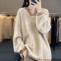 Women's camel coloured V-neck long sleeve viscose pullover sweater on a hanger.