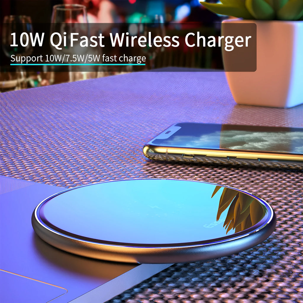 Black or white 15W Qi wireless charging pad on a table with LED light and phone charging.