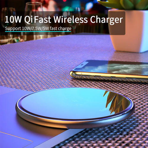 Black or white 15W Qi wireless charging pad on a table with LED light and phone charging.
