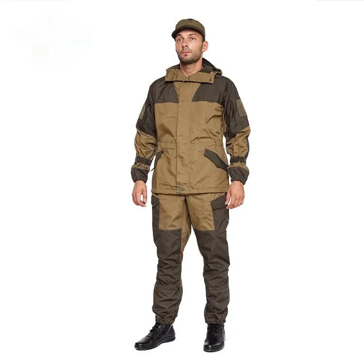 Men's special forces tactical jacket and trousers set in olive green, shown in an outdoor setting.