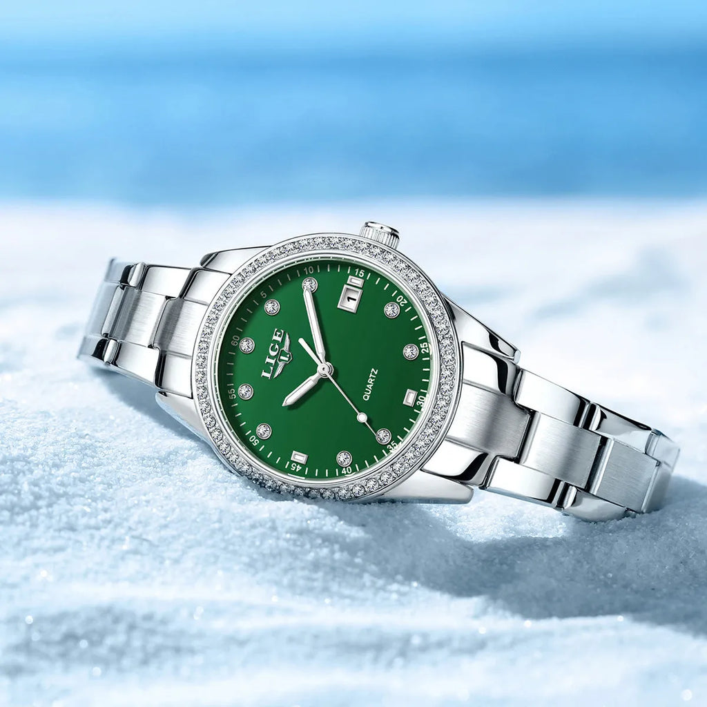 Silver stainless steel fashion quartz watch with diamond accents on dial, showing luminous markers.