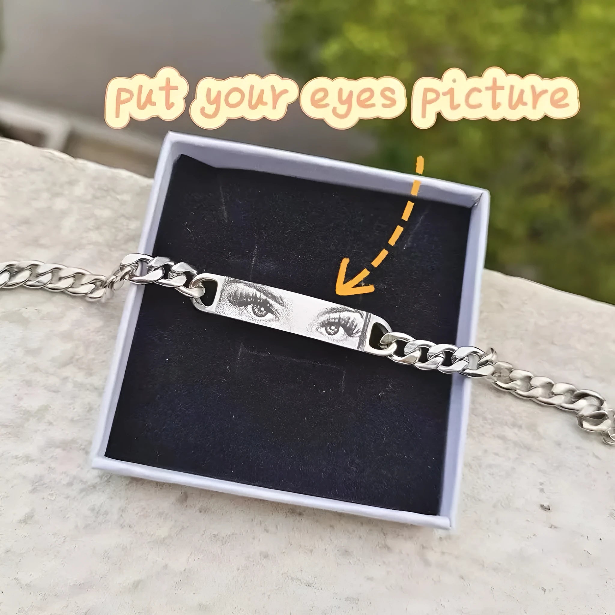 Personalised stainless steel bracelet with laser engraved human eye design, available in black, gold, and silver finishes