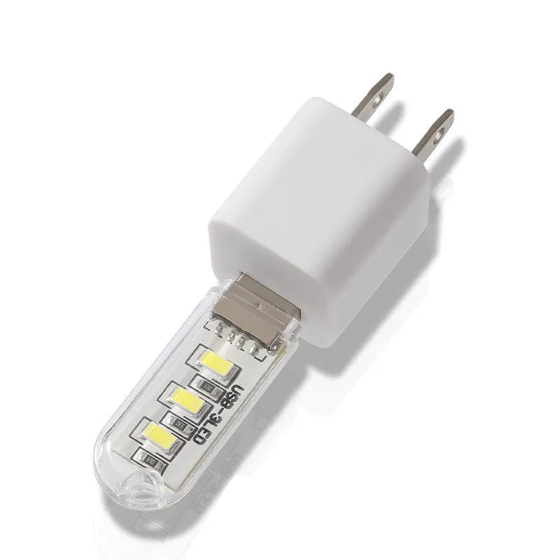 Compact white PC USB LED night light showing warm and white light colour options.
