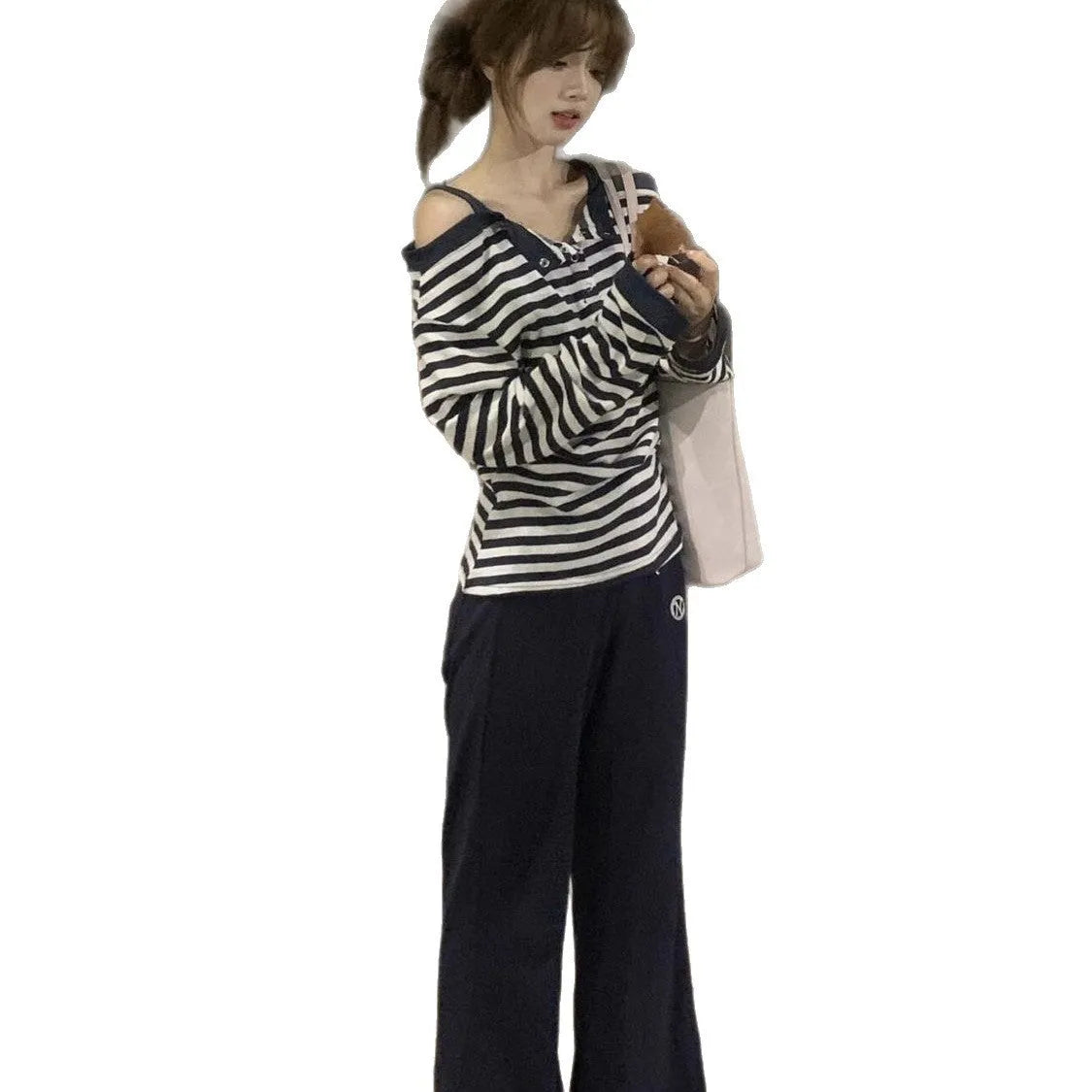 Dark blue women's oversized long-sleeve T-shirt with stripes, buttons, and embroidery details.