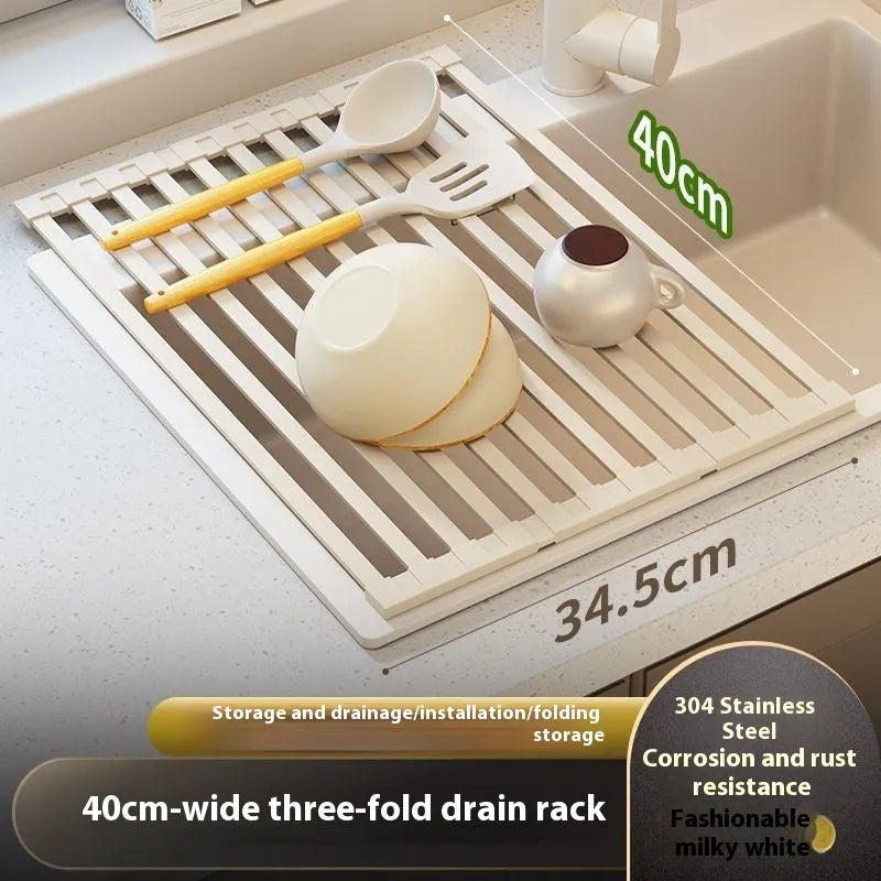 Milky white foldable stainless steel kitchen draining rack placed next to a sink.