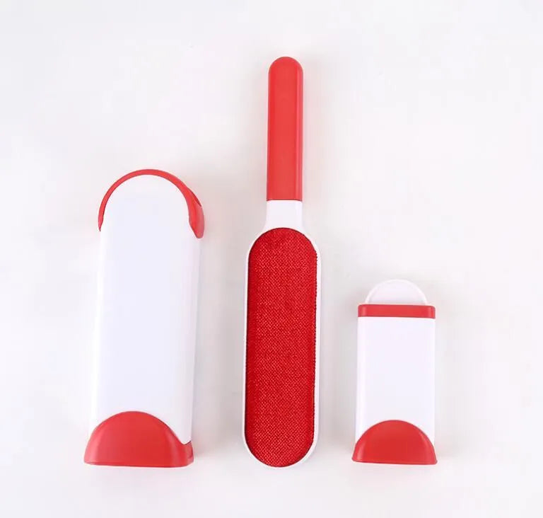 Blue reusable pet hair removal comb with a double-sided sticky brush head and a matching self-cleaning base.