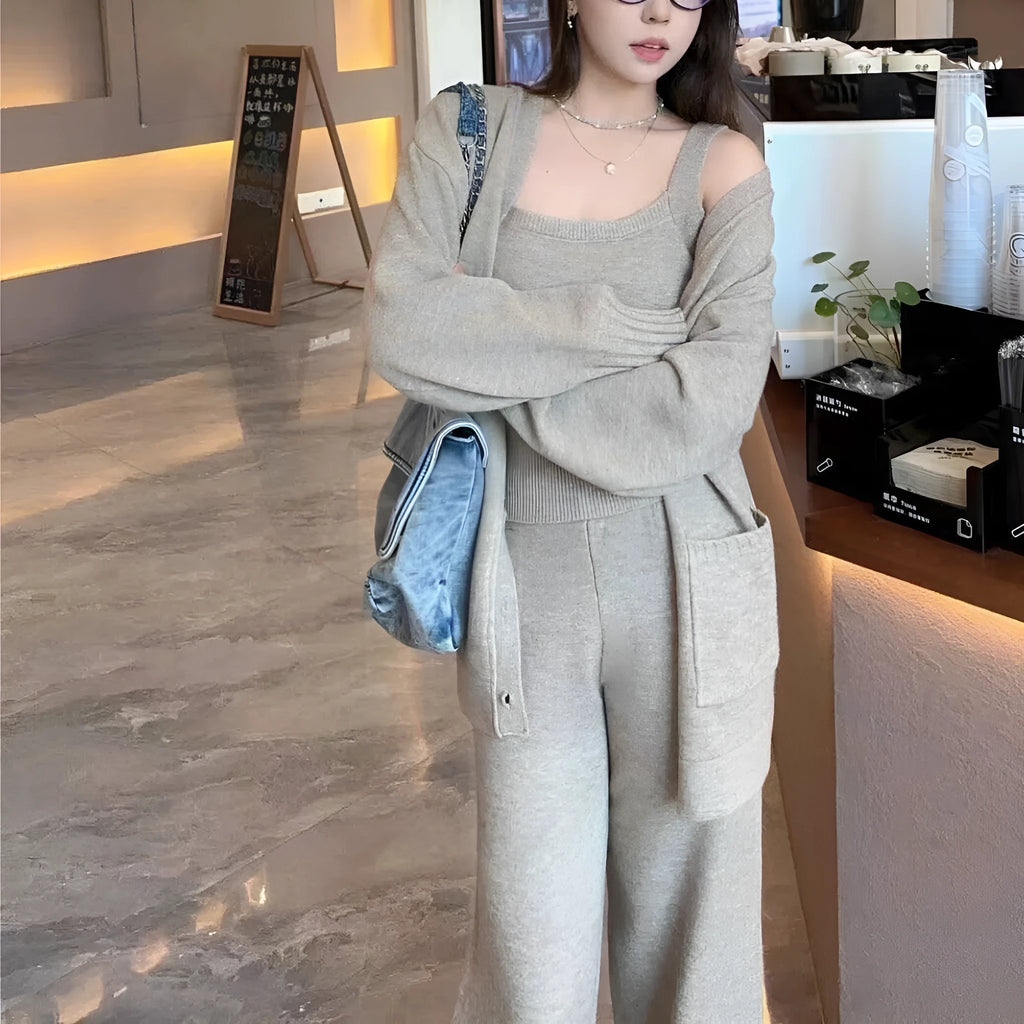 Women's light brown wool-blend knit cardigan vest and loose trousers three-piece set laid flat