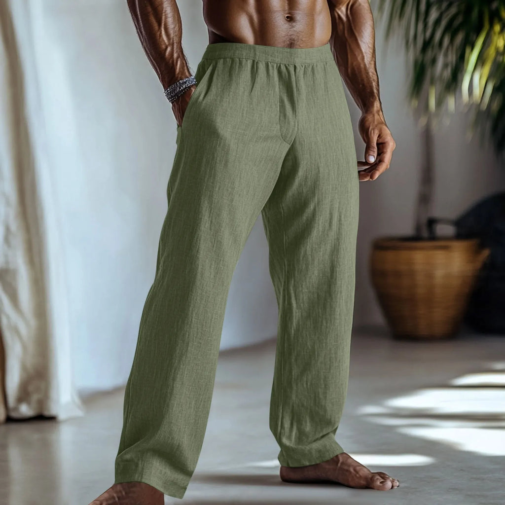 Straight-leg cotton linen trousers in light green colour with visible pockets and British style design.