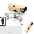 Green folding camping gas stove with burner, serrated bracket, and anti-slip feet on a tabletop